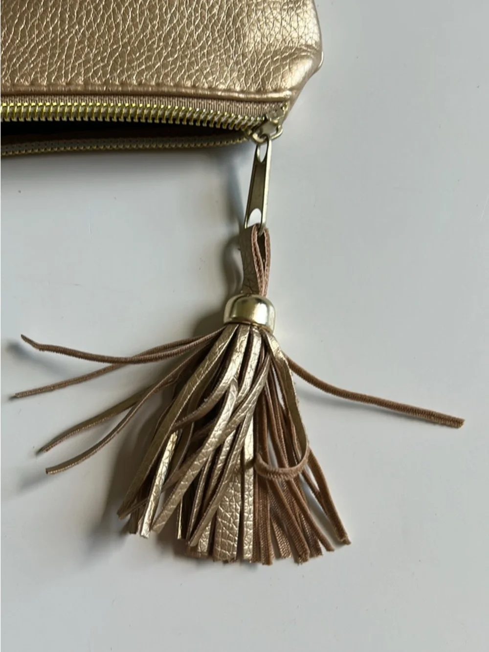 Metallic Gold Wristlet Clutch with Tassel Accent